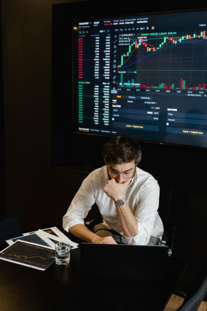 Mastering the First Impression: Your intriguing post title goes here Adult man analyzing cryptocurrency data on a computer screen in an office setting.
