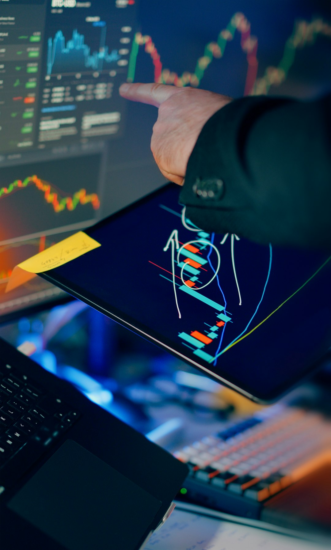 Offerings Financial trading workstation stock crypto investment analysis. Closeup hand pointing touchscreen displaying candlestick charts indicators price movement market volatility savings investing portfolio calculation smartphone tablet laptop monitors desktop finance technology night lighting focus strategy performance growth profit risk management economy currency blockchain